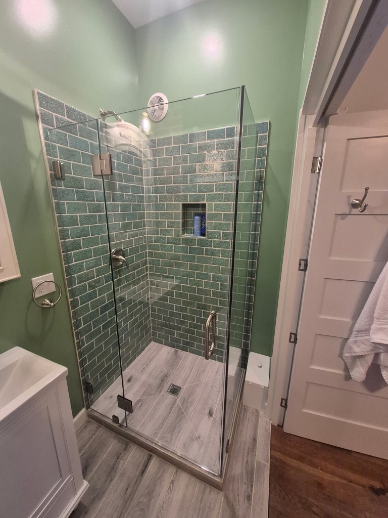 Frameless glass shower door installed in a San Jose bathroom