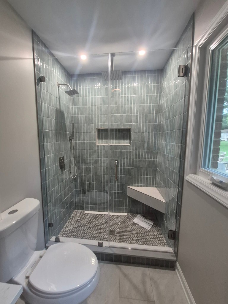 Fixed glass shower panel installed in a Milpitas walk-in shower