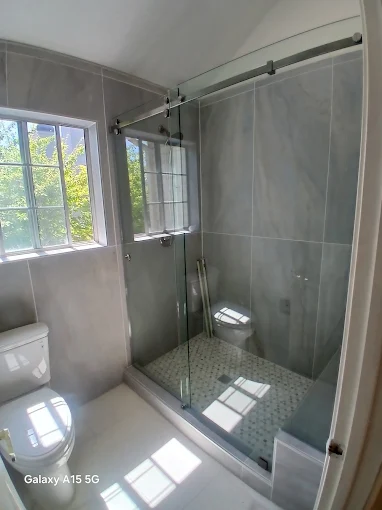 Sliding frameless shower door on a track in Mountain View